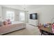 Bedroom with a pink theme featuring a large window and soft carpet at 521 Glenwyck Ct, Fuquay Varina, NC 27526
