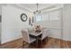 Dining room with a wooden table, seating for six, and elegant lighting fixture at 521 Glenwyck Ct, Fuquay Varina, NC 27526