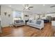 Open-concept living room flows into a modern kitchen with stainless steel appliances at 521 Glenwyck Ct, Fuquay Varina, NC 27526