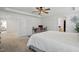 Spacious main bedroom features a tray ceiling, ceiling fan, and adjoined bathroom at 521 Glenwyck Ct, Fuquay Varina, NC 27526