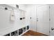 Mudroom boasts built in bench with storage baskets and wall hooks at 521 Glenwyck Ct, Fuquay Varina, NC 27526