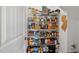 Walk-in pantry offers an abundance of shelving for food storage at 521 Glenwyck Ct, Fuquay Varina, NC 27526
