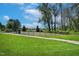 Community park with open green space, walking path, and fenced play area at 521 Glenwyck Ct, Fuquay Varina, NC 27526