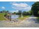 Scenic view of a tranquil pond with lush green surroundings and a walking path at 521 Glenwyck Ct, Fuquay Varina, NC 27526