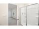 Bathroom featuring a glass-enclosed shower and doorway to a bedroom at 5520 Musket Ct, Raleigh, NC 27610