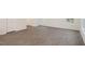 Open living space featuring wood-look floors, neutral walls, and natural light at 5520 Musket Ct, Raleigh, NC 27610