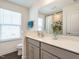 This well-lit bathroom has a modern vanity, gray cabinets, and stylish decor at 555 Whitley Ridge Dr, Clayton, NC 27527