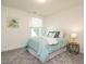 Cozy bedroom with plush carpet, a comfortable bed, a window, and a stylish bedside table at 555 Whitley Ridge Dr, Clayton, NC 27527