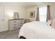Cozy bedroom featuring a dresser, comfy bed with soft carpet, and natural light from the window at 555 Whitley Ridge Dr, Clayton, NC 27527