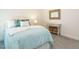 This charming bedroom features cool tones, soft textures, and an ornate wall mirror at 555 Whitley Ridge Dr, Clayton, NC 27527