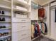 Organized walk-in closet features built-in shelving, drawers, hanging rods, and ample storage for shoes and clothing at 555 Whitley Ridge Dr, Clayton, NC 27527