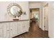 Inviting entryway featuring a decorative mirror, stylish console table, and hardwood floors at 555 Whitley Ridge Dr, Clayton, NC 27527