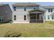 This home features a level backyard with a covered porch at 555 Whitley Ridge Dr, Clayton, NC 27527