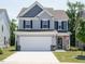 Beautiful two-story home featuring a spacious driveway and a well-kept lawn at 555 Whitley Ridge Dr, Clayton, NC 27527