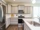 Stylish kitchen with stainless steel appliances and quartz countertops at 555 Whitley Ridge Dr, Clayton, NC 27527
