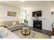 Inviting living room with a fireplace, comfortable seating, and stylish decor at 555 Whitley Ridge Dr, Clayton, NC 27527