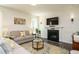 Inviting living room with a cozy fireplace, comfortable seating, and stylish decor at 555 Whitley Ridge Dr, Clayton, NC 27527