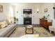 Charming living room featuring a fireplace, stylish decor, and comfortable seating area at 555 Whitley Ridge Dr, Clayton, NC 27527