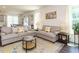 Bright living room with sofas, curtains, and decorative accents at 555 Whitley Ridge Dr, Clayton, NC 27527
