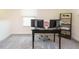 This office features neutral walls, plush carpeting, dark desk with two monitors, and a wood and metal bookshelf at 555 Whitley Ridge Dr, Clayton, NC 27527