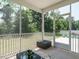 Inviting screened porch with outdoor furniture and serene views of the green backyard at 555 Whitley Ridge Dr, Clayton, NC 27527