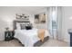 Inviting bedroom with carpeted floor and a large window providing natural light at 5913 Sodium St, Raleigh, NC 27610
