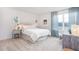 Well-lit bedroom with soft carpet, neutral colors, and large window at 5913 Sodium St, Raleigh, NC 27610