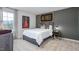 Stylish bedroom featuring gray accent wall and comfortable carpet at 5913 Sodium St, Raleigh, NC 27610