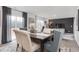 Elegant dining room with stylish chairs, a modern rug, and sliding glass doors at 5913 Sodium St, Raleigh, NC 27610