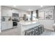 Modern kitchen with stainless steel appliances, gray cabinets, and granite countertops at 5913 Sodium St, Raleigh, NC 27610