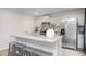 Bright kitchen with a large island, stainless steel appliances, and modern cabinets at 5913 Sodium St, Raleigh, NC 27610