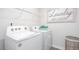 Functional laundry room area with new washer and dryer and shelf at 5913 Sodium St, Raleigh, NC 27610