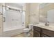 Well-lit bathroom featuring a shower and tub combo, vanity with sink, and matching toilet at 624 Meadowgrass Ln, Wake Forest, NC 27587