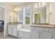 Bathroom with double sink vanity, granite countertop, and bright natural light at 624 Meadowgrass Ln, Wake Forest, NC 27587