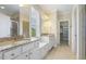 Bathroom featuring double sink vanity, granite countertops, and tile flooring at 624 Meadowgrass Ln, Wake Forest, NC 27587