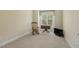 Bright bedroom featuring neutral walls, plush carpeting, and natural light from a large window at 624 Meadowgrass Ln, Wake Forest, NC 27587