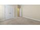 Bedroom with neutral carpet, double door closet, and open doorway leading to adjoining rooms at 624 Meadowgrass Ln, Wake Forest, NC 27587