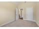 Bedroom featuring neutral walls, plush carpeting, and doorways leading to adjoining rooms at 624 Meadowgrass Ln, Wake Forest, NC 27587