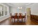 Formal dining room featuring hardwood floors, classic chandelier, and traditional decor at 624 Meadowgrass Ln, Wake Forest, NC 27587