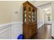 Hallway with hardwood floors and traditional wainscoting leading to the front door at 624 Meadowgrass Ln, Wake Forest, NC 27587