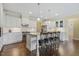 Spacious kitchen featuring white cabinetry, granite counters, stainless appliances, and a central island at 624 Meadowgrass Ln, Wake Forest, NC 27587