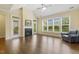 Bright living room with hardwood floors, fireplace, vaulted ceiling, and large windows at 624 Meadowgrass Ln, Wake Forest, NC 27587