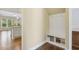 Hallway with built-in mudroom storage, bench, and shelves in an alcove at 624 Meadowgrass Ln, Wake Forest, NC 27587