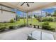 Screened patio with seating area, offering a relaxing outdoor space with scenic views of the lush backyard at 624 Meadowgrass Ln, Wake Forest, NC 27587