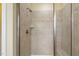 Tiled shower with glass door and built-in bench at 624 Meadowgrass Ln, Wake Forest, NC 27587