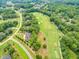 Beautiful aerial view of the golf course, showcasing the home's proximity to recreational amenities at 7304 Hasentree Club Dr, Wake Forest, NC 27587