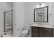 The bathroom features a walk-in shower, toilet, and vanity with sink and large mirror at 7304 Hasentree Club Dr, Wake Forest, NC 27587