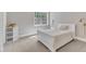 Bedroom with neutral decor, natural light and featuring a plush white bed with matching accents at 7304 Hasentree Club Dr, Wake Forest, NC 27587