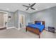 Bedroom featuring soft carpet, natural light, and an ensuite bathroom with a marble floor at 7304 Hasentree Club Dr, Wake Forest, NC 27587