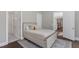 Cozy bedroom with a comfortable bed, soft carpet, and easy access to the adjoining rooms at 7304 Hasentree Club Dr, Wake Forest, NC 27587